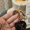 LOUIS VUITTON Cherry Bag Charm - PopRock Vintage. The cool quotes t-shirt store.